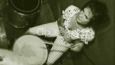Girl plays the drums