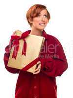 Pretty Red Haired Girl Biting Lip Holding Wrapped Gift
