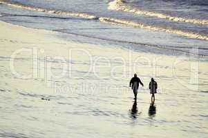 Couple walking at the beach