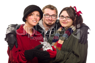 Three Friends Holding A Holiday Gift Isolated