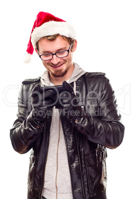 Young Man with Santa Hat Using Cell Phone