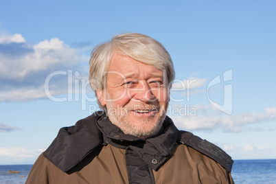 Portrait of middle-aged man at the sea.