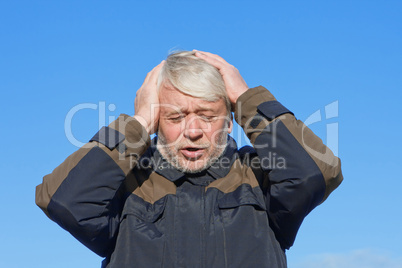 Portrait of middle-aged man on blue sky of the background.