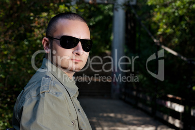 Cute man posing in forest