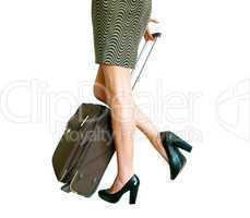 Woman's legs with suitcase