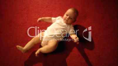 Child lying on the carpet