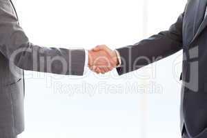 close up of businessmen shaking their hands after a meeting