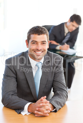 Cheerful businessman during a meeting with a colleague