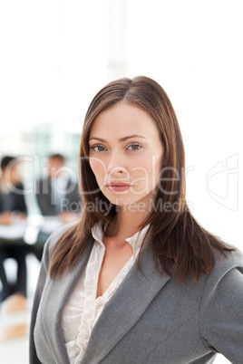 Serious businesswoman during a meeting with two businessmen