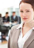 Attractive businesswoman during a meeting with her team