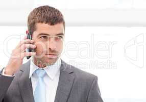 Handsome hispanic businessman on the phone