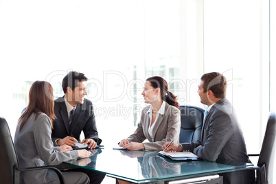 Happy businessteam talking together during a meeting
