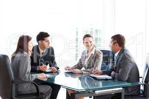 Businessmen and businesswomen talking during a meeting