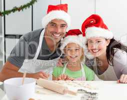 Happy family preparing Christmas cookies