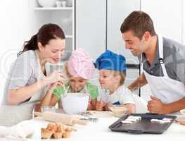 Adorable family baking together in the kitchen