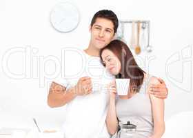 Lovely couple drinking coffee during breakfast