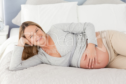 Happy future mom touching her belly