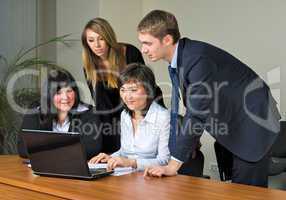 Businessgroup with laptop
