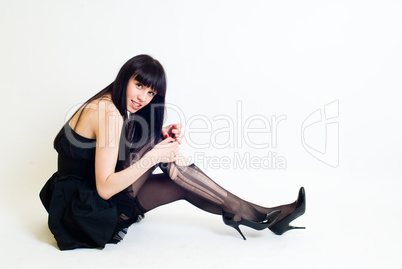 Young woman in torn stockings