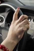 Girl hand on wheel steering