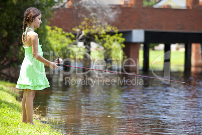 Pretty Young Girl Child Fishing On A RIver