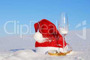 Traditional Santa hat on winter background