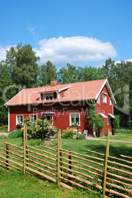 Red Swedish house in the middle of nature