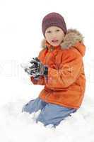 Boy plays with a snow