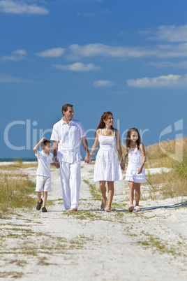 Mother, Father and Children Family Walking On Beach