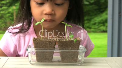 Little Girl Proud Of Her New Plants