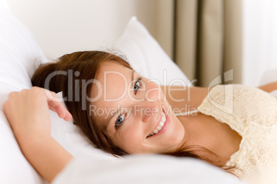 Bedroom - happy woman in white bed