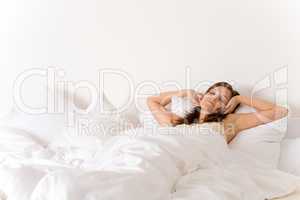 Bedroom - woman waking up and stretching