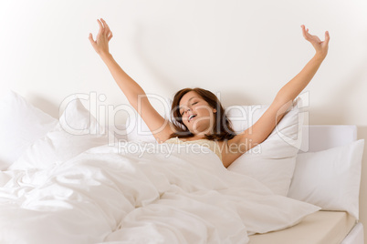 Bedroom - woman waking up and stretching