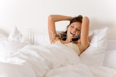 Bedroom - woman waking up and stretching