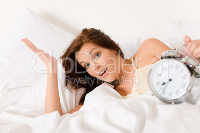 Bedroom - woman with alarm clock wake up