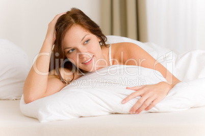 Bedroom - happy woman in white bed