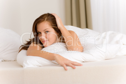 Bedroom - happy woman in white bed