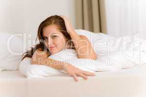 Bedroom - happy woman in white bed