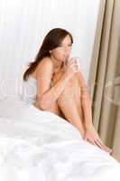 Bedroom - young woman drink coffee relaxing