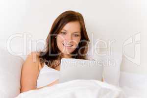 Touch screen tablet computer - woman in bed