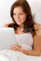 Touch screen tablet computer - woman in bed