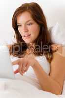 Touch screen tablet computer - woman in bed