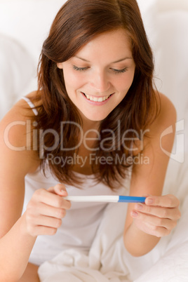 Pregnancy test - happy surprised woman