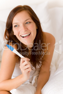 Pregnancy test - happy surprised woman