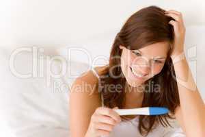 Pregnancy test - happy surprised woman