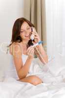 Pregnancy test - happy woman on phone