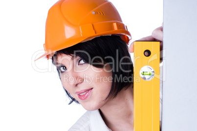 Woman in helmet with level