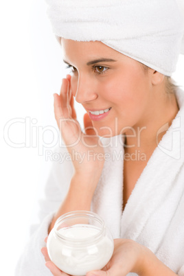 Teenager skin care - woman apply moisturizer