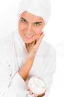 Teenager skin care - woman apply moisturizer