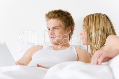 Bedroom - young couple with laptop